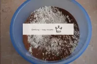 In a separate bowl, combine the flour, cocoa, soda...