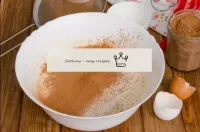 Sift flour and cocoa powder to the egg mass. Sievi...