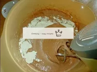 Following the cocoa, pour the sifted flour with ba...