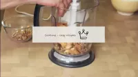 Shred the cookies and nuts together into crumbs. ...