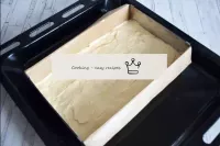 Place the dough in a baking tin and flatten with a...