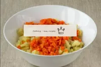 Add the boiled carrots crushed also in small cubes...