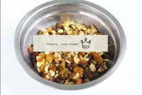 Combine the raisins and crushed walnuts in a bowl,...