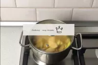 We put dishes with apples on fire. We have to boil...