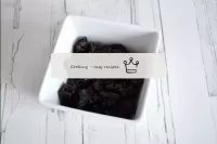 Wash prunes, dry and cut into small pieces. ...