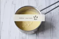 Cook the cream with constant stirring until thicke...