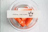 Clean the crab sticks from the wrappers. If they h...