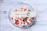 Clean the crab sticks from the factory film and al...