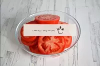 Wash the tomatoes as well, dry and cut into circle...