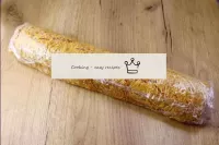 Wrap the roll completely with cling film and trans...
