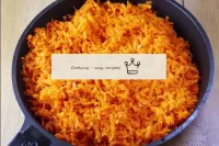 Transfer the grated carrots to a frying pan, cover...