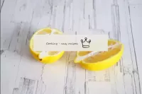Wash the lemon thoroughly, wipe and cut in half. Y...