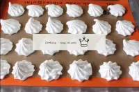 Start planting marshmallows from pastry bags on pa...