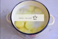 Cover the peeled potatoes with water, place on hea...