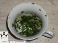 Grind garlic with parsley greens. ...