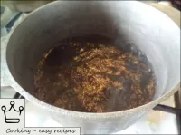 How to make mamalyga: Water is poured into the cas...