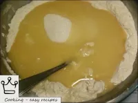 Pour margarine into the dough. ...