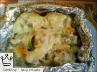 Baked cod is fed hot. The dish is served with a gr...