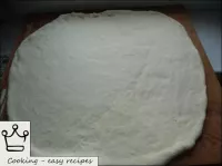 The finished dough is rolled to a thickness of 0. ...