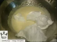 Add a fourth of the whipped proteins to the whippe...