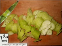 Then cut the cucumbers into thin slices. ...