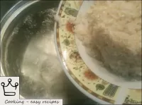 Pour the rice into boiling salted water (1-1. 2 li...