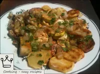 Potatoes with zucchini and mushrooms are ready. Sp...