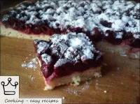 Baked yeast cake with cherries can be sprinkled wi...