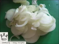 Onions are peeled, washed and chopped with rings. ...