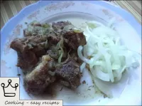 The meat is served in Uzbek with pickled onions. E...