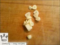 Peel the garlic, chop. ...