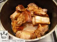 Put the fried ribs in cast iron or sauté pan (volu...