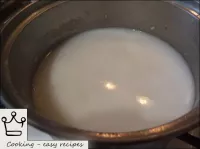 Then pour the hot milk into a pan of rice. ...