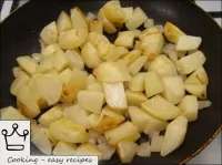 The potatoes are dried and placed in a frying pan ...