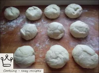 Dough is cut into tortillas weighing 50 grams. ...