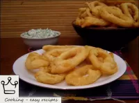 Battered squid are ready. Enjoy your meal!...