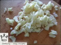 Peel the garlic, finely chop. ...