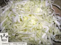 Peel the cabbage from the top leaves. Cut into str...