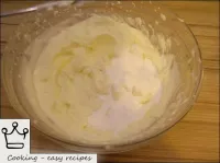 Gradually add sugar powder, and then vanilla powde...