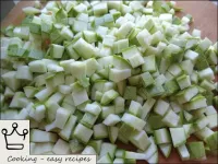 Wash the courgettes, cut into cubes. ...