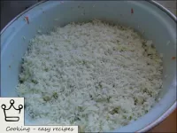Pour rice on top of zucchini, level. ...