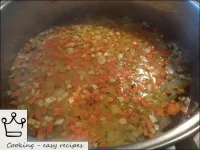 Boil 1. 5 liters of water. Put fried carrots, onio...