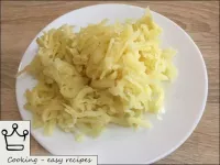 Peel and grate the cooled potatoes on a coarse gra...