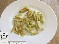 Peel the apples and core and cut into strips. Pour...