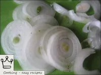 Peel the onion and cut into rings. ...