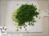 The spring onions are finely chopped. ...