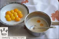 Yolks are added to the oil. ...
