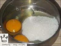 Eggs are mixed with sugar and vanilla sugar in a s...