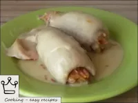 Serve the stuffed squid in the sour cream sauce to...