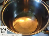Heat vegetable oil in a saucepan with a thick bott...